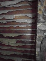 Exposed plaster wall