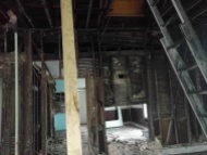 Another view of the missing fireplace. And yes, the two-by-four is currently helping to hold up one of the ceiling beams.