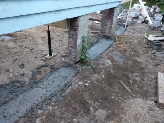 More concrete footings so the house won't shift when the sandy soil washes away